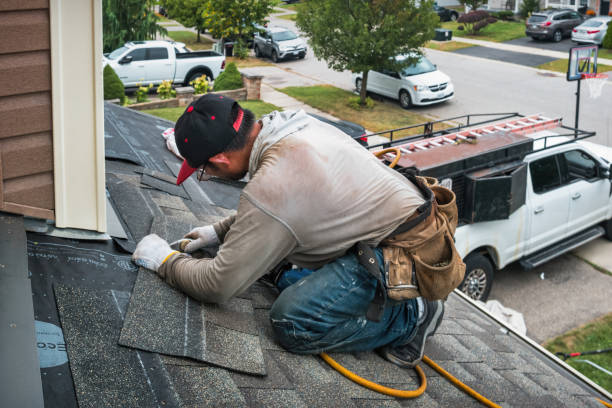 Professional Gutter Installation technician working in Harwood, MD
